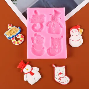 Detailed view of pink silicone mold featuring Christmas snowman and stocking designs.