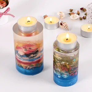 Detail showing ocean-themed resin candle holders with embedded shells and dried flowers