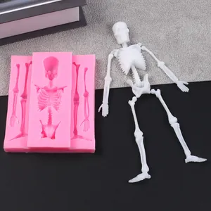 Detailed view of Halloween skeleton silicone mold with finished white resin figure