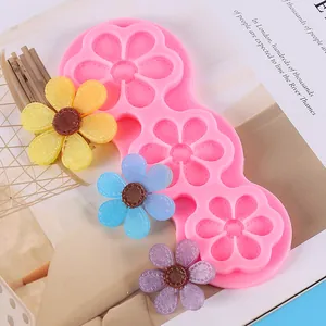 Detail view of pink 3-cavity sunflower silicone mold with resin flower accessories