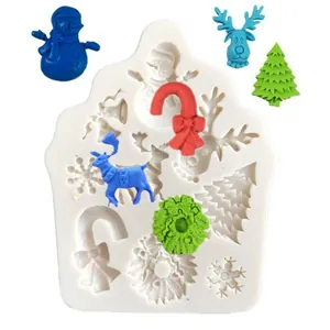 Detailed view of the Christmas themed silicone mold showing reindeer, tree and snowman shapes.