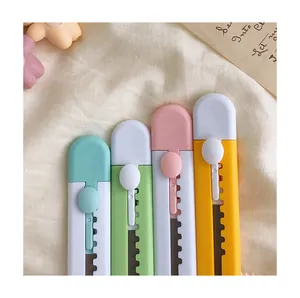 Detailed view of four mini box openers in pastel candy colors for school and office