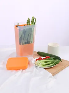 Bac de conservation des légumes transparent avec couvercle et panier orange en cuisine