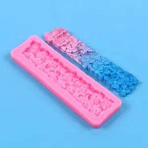Detail of plum blossom lace silicone mold with purple-blue gradient flower strip.