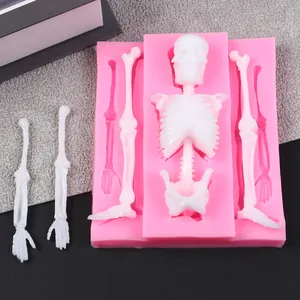 Detailed macro view of pink silicone skeleton mold for Halloween cake decoration