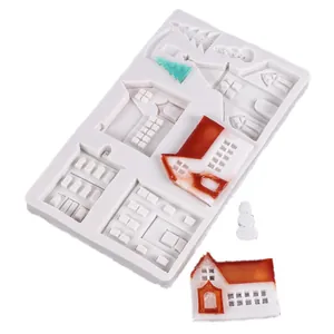 Close-up detail of white silicone mold for Christmas gingerbread houses and snowmen shapes