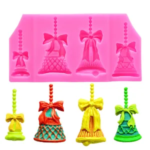 Detailed view of Christmas bell silicone mold with bows and four finished color samples.