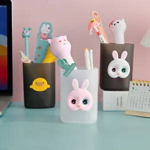 Cute cartoon pen holder set for desk organization with bunny and duck designs.
