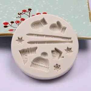Detailed view of Christmas themed silicone mold with snowflakes and mittens patterns.
