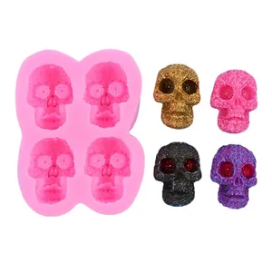 Detail view of pink 4-cavity skull silicone mold for Halloween cake and candle DIY