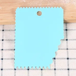 Light blue plastic serrated dough scraper and cake decorating tool for kitchen baking DIY