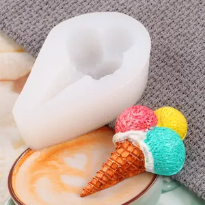 Close-up of DIY ice cream cone silicone mold alongside a colorful finished resin ornament