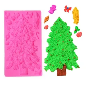 Detailed view of pink silicone mold featuring Christmas tree and gingerbread man shapes