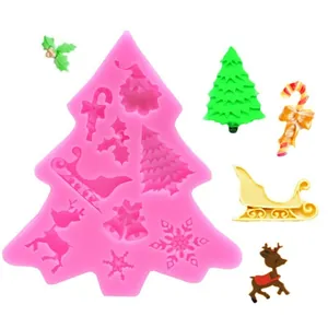 Christmas tree silicone mold with reindeer and snowflake shapes for festive cake decor.