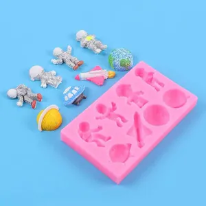 Space-themed silicone mold for fondant and chocolate featuring astronauts and rockets