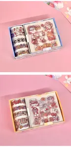 Detailed macro view of cute cartoon girl themed washi tape and sticker gift box set