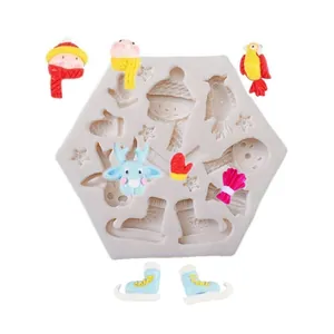 Detailed view of hexagonal Christmas silicone mold with finished colorful resin figures