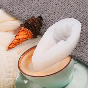 Detail of a silicone ice cream cone mold next to a chocolate dessert decoration.