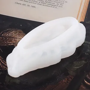 Detailed close-up view of a white translucent silicone mold for DIY crystal cluster resin crafts