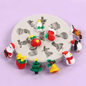 Detail showing a Christmas silicone mold with festive finished Santa and tree shapes