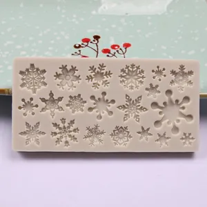 Detailed view of flexible silicone mold featuring multiple intricate snowflake patterns