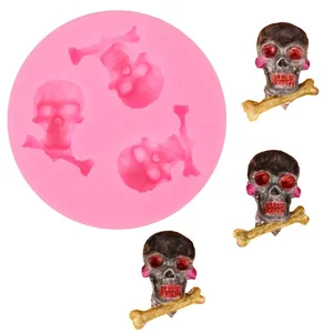 Detailed view of pink silicone skull mold with finished Halloween chocolate skull samples