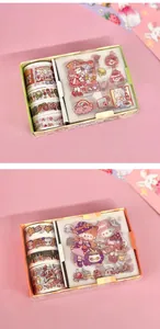 Close-up of two cute washi tape and sticker gift sets for DIY journaling decoration