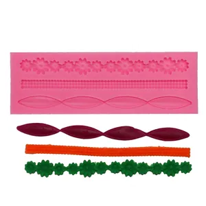 Detail of pink silicone fondant border mold with flower and line pattern samples