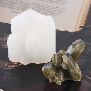 Close-up detail of a translucent silicone mold and its finished resin crystal cluster piece