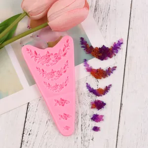 Detailed view of floral silicone mold with colorful resin flower pieces