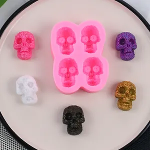Professional 4-cavity skull silicone mold for DIY Halloween chocolate and cake decoration.