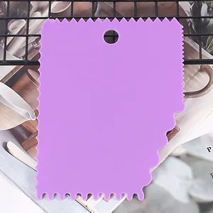 Detailed view of a purple plastic cake scraper featuring various serrated edges for baking