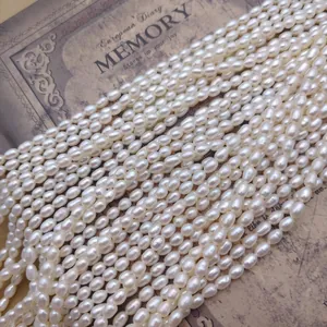 Close-up detail of lustrous white freshwater rice pearl strands for DIY jewelry making