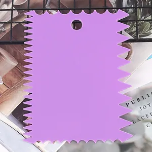 Detailed view of a purple plastic serrated cake scraper tool for DIY baking and icing