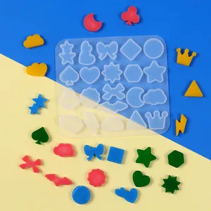 Detailed view of silicone mold with various mini geometric shapes for DIY jewelry making