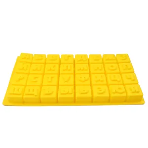 Detailed view of a yellow silicone mold featuring 3D Russian Cyrillic alphabet letters