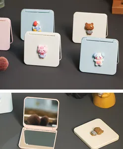 Detailed view of portable folding makeup mirror with cute 3D cartoon animal designs