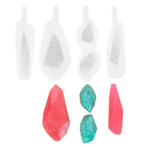 Set of diamond and rhombus shaped silicone molds with finished crystal resin pendants.
