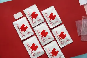 7er-Pack 60ml transparente Puzzelkleber-Beutel mit weißem Applikator-Schaber-Tool
