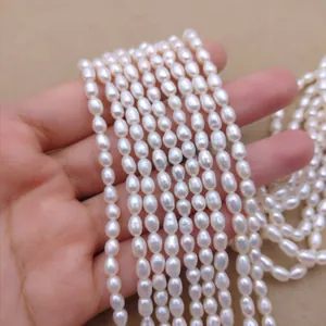 Close-up of small rice-shaped white freshwater pearls for DIY jewelry craft making