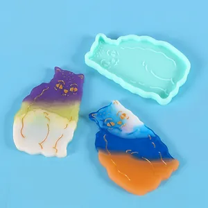 Detailed macro view of DIY cat-shaped silicone mold and finished colorful resin hairpins