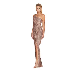 Elegant one-shoulder rose gold sequin maxi dress with a side slit and waist tie detail.