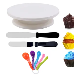 Comprehensive cake decorating set including turntable, spatulas, and measuring spoons.