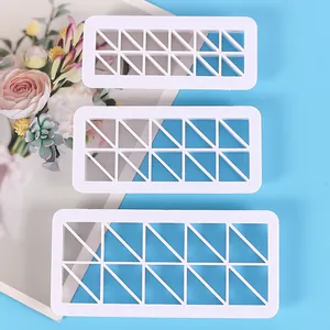 Three pieces of plastic geometric triangle pattern biscuit cutters for DIY cake baking