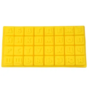 Detailed view of a yellow silicone mold featuring 32 Russian Cyrillic alphabet letters.
