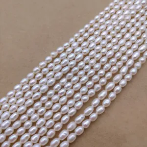 Detailed macro view of multiple strands of lustrous white freshwater rice pearls for DIY jewelry