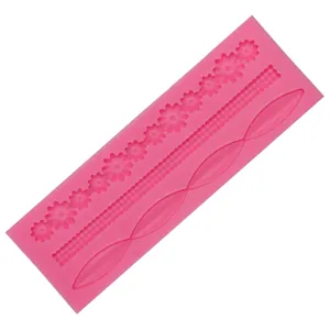 Detail view of pink long silicone mold with floral and geometric patterns for fondant