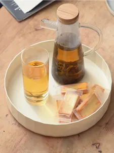 Vue détaillée d'un plateau de rangement rotatif crème multifonctionnel pour le thé et snacks