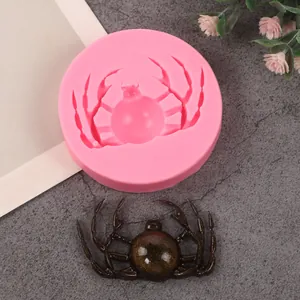 Detail view of spider-shaped pink silicone mold for Halloween cake decorating crafts
