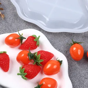 Detail shot of cloud tray silicone mold with finished product and decorative fruit